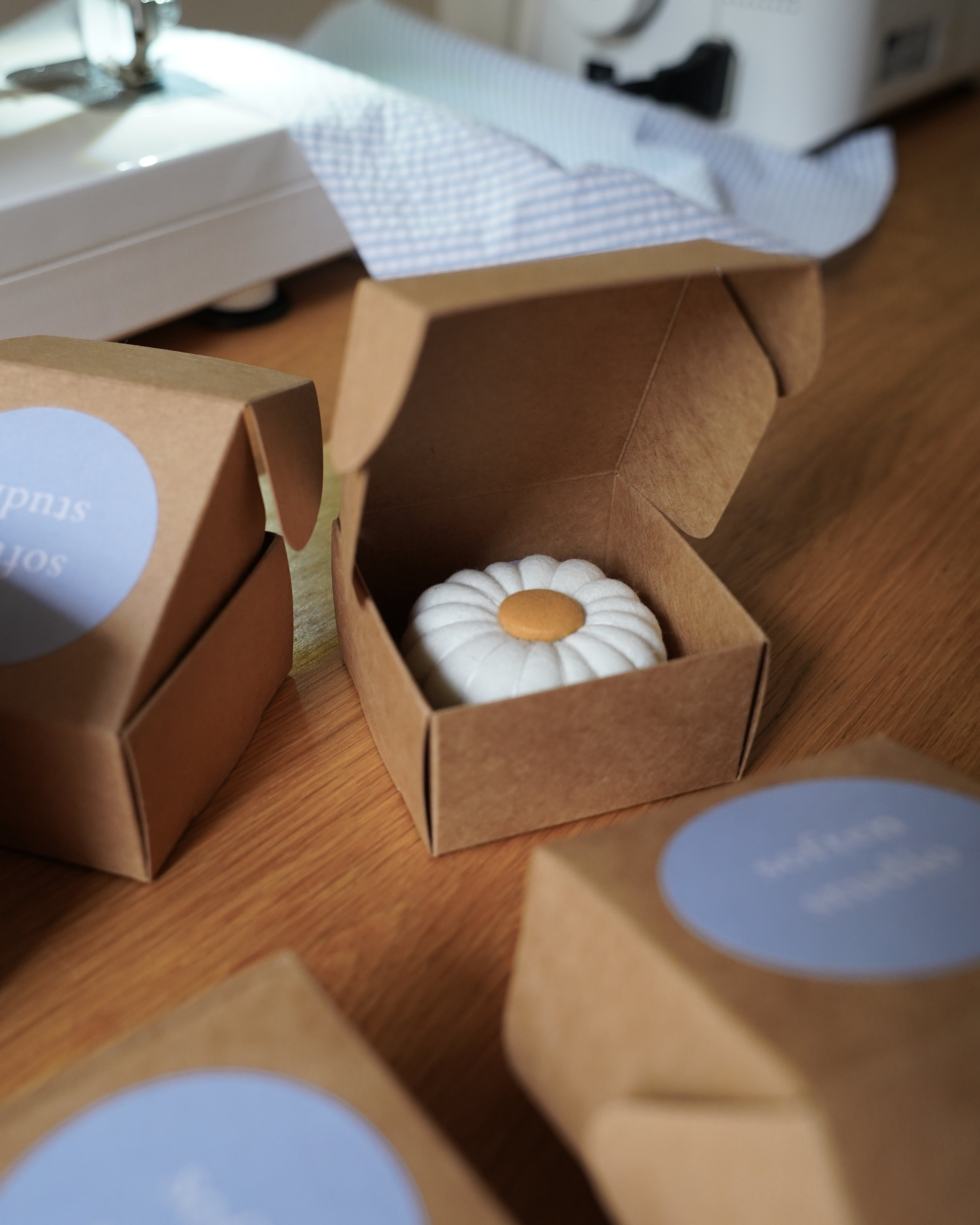 Soften Studio pin cushion is displayed in a box